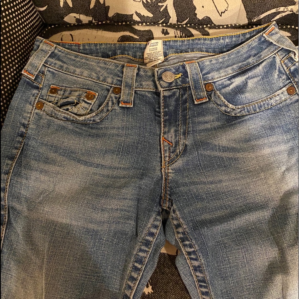This is a pair of True Religion jeans, size 31/32.
